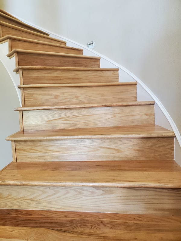 Red Oak treads and risers with natural finish 2 Red Oak treads and risers with natural finish on a curved staircase