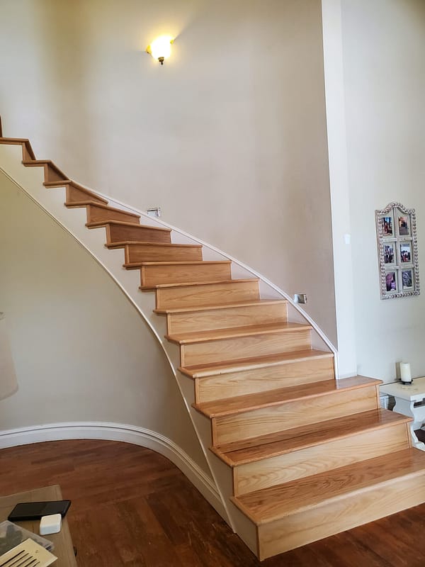 Red Oak treads and risers with natural finish 1 Red Oak treads and risers with natural finish on a curved staircase