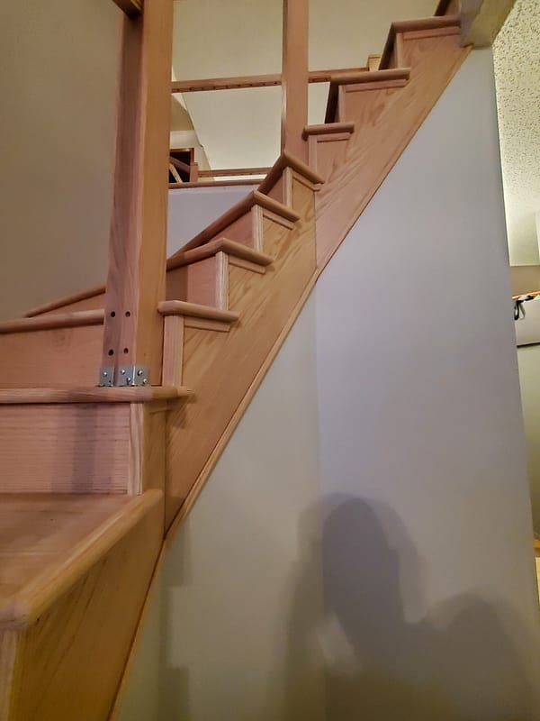Red Oak stairs and risers with natural finish 3 Red Oak tread and risers with natural finish on twisting staircase